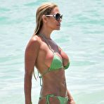 Fourth pic of Busty Shauna Sand sexy in green bikini on the beach in Miami