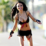Second pic of Tila Tequila nipple slip in black bikini when rollerblading in Miami