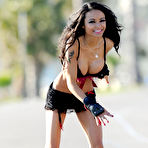 Third pic of Tila Tequila nipple slip in black bikini when rollerblading in Miami