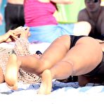 Fourth pic of Christina Milian sunbathing in black swimsuit