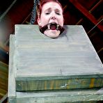 Fourth pic of SexPreviews - Ashley Lane redhead is bound in dungeon with leather mask and dribbling