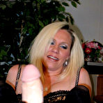 Third pic of Nikki in a black stockings gives a footjob to a big dildo