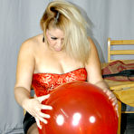 Second pic of Juicy Butt dominatrix Savannah Taylor spanking big balloons