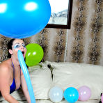 Second pic of Busty porn star Sophie Dee popping balloons