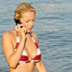 Fourth pic of Gemma Garrett shows cleavage on the beach paparazzi shots