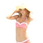 Third pic of Miranda Kerr posing in varioues sexy bikinies on the beach