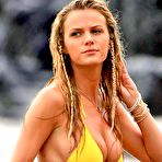 First pic of Brooklyn Decker shows deep cleavage in yellow bikini on the beach