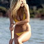 Third pic of Brooklyn Decker shows deep cleavage in yellow bikini on the beach