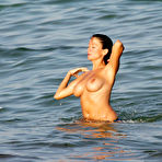 First pic of Busty Rebecca Loos caught topless on the beach