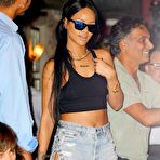 Fourth pic of Rihanna pokies under black short top