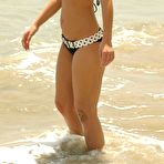 Fourth pic of Hotty Stop / Kari Sweets romps about on the beach in a tiny polka dot bikini showing off her hot teen body