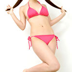 Second pic of Mizuho Shiraishi with cans in pink bath suit plays with her hair