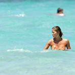 First pic of Elena Santarelli boobslip and ass crack on the beach