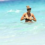 Second pic of Elena Santarelli boobslip and ass crack on the beach