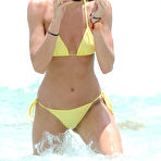 Second pic of Candice Swanepoel in yellow bikini on the beach