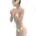 Third pic of Candice Swanepoel in yellow bikini on the beach