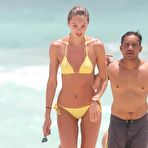 Fourth pic of Candice Swanepoel in yellow bikini on the beach