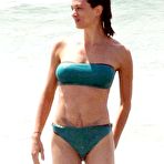 Fourth pic of Asia Argento in blue bikini on the beach with her husband