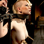 Second pic of SexPreviews - Alani Pi in metal device bondage gets her head completely shaved in live show