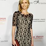 First pic of Charlize Theron posing for paparqazzi shows legs