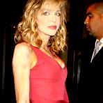 First pic of Courtney Love shows cleavage in red tight dress at premiere of Wall Street Money Never Sleeps