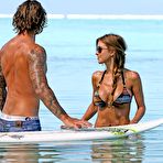 Third pic of Audrina Patridge shows deep cleavage in green bikini when relaxing on a tropical vacation