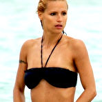 Third pic of Michelle Hunziker caught in black bikini on the beach