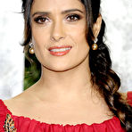 First pic of Salma Hayek in red dress posing at 2012 Vanity Fair Oscar Party