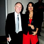 First pic of Salma Hayek slight cleavage in red dress at Yves Saint Laurent fashion show