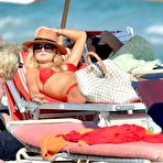 First pic of Emma Rigby sunbathing in red bikini