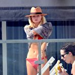 Third pic of Emma Rigby sunbathing in red bikini