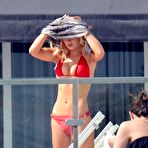 Fourth pic of Emma Rigby sunbathing in red bikini