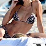 Second pic of Claudia Galanti sunbathing topless on the beach in Miami