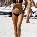Third pic of Lauren Stoner in black bikini on a beach