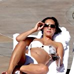 First pic of Myleene Klass sunbathing in white bikini and braless