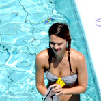 Fourth pic of Jessica Alba swimming in the pool in gray bikini