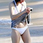 First pic of Milla Jovovich on the beach in white bikini