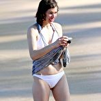 Third pic of Milla Jovovich on the beach in white bikini