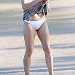 Fourth pic of Milla Jovovich on the beach in white bikini