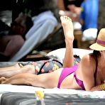 Fourth pic of Brooke Burke wearing a bikini poolside shots