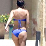 Fourth pic of Kourtney Kardashian wearing a bikini at a pool in Mexico