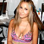 Third pic of Busty Adrienne Bailon shows cleavage at fashon show