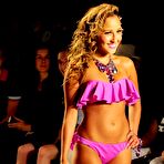 First pic of Busty Adrienne Bailon in yellow and pink bikinies runway shots