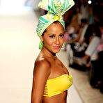 Fourth pic of Busty Adrienne Bailon in yellow and pink bikinies runway shots