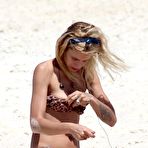 First pic of Alice Dellal areola slip in bikini on the beach