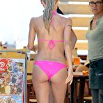 Third pic of Michelle Hunziker in pik bikini on the beach in Italy