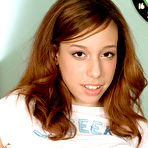 Third pic of Redhead Latina Niki Fair uncovers a stunning teen body that hides underneath her clothes.
