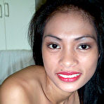 Second pic of Horny young Filipina chick spreading legs in white stockings
