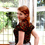 Third pic of Softcore redhead Fawna Latrisch reveals her delightful body after a painfully slow striptease.