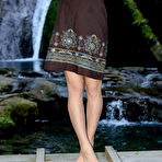 First pic of Cute Nensi B showcasing her delightfully petite body against a refreshing view of the cascading waterfalls.